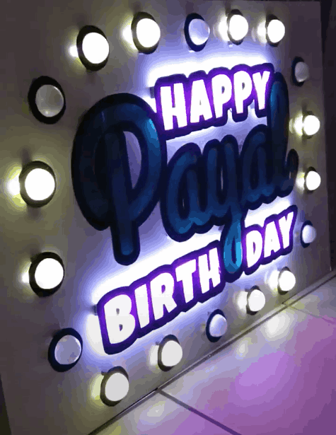 Animated neon style "Happy Birthday Payal" sign with chaser bulbs.  Created with an ATTiny85, 12v led strip, 74ch595 Shift Registers, and P30N06L MOSFETS