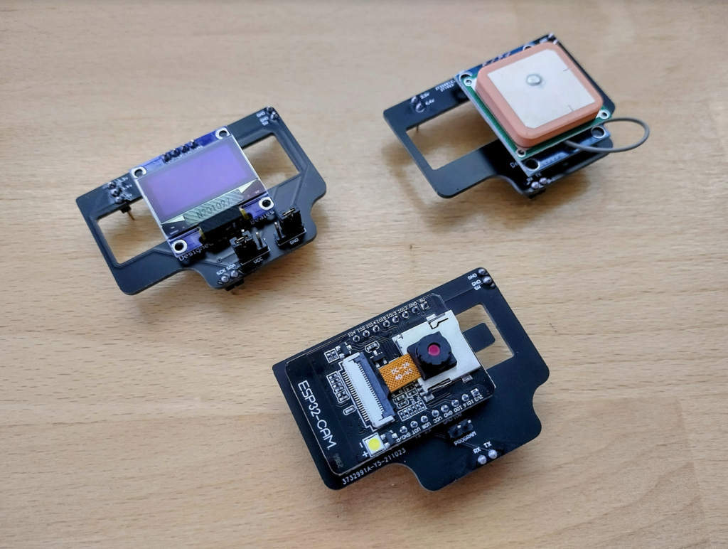 An OLED shield, NEO-6M GPS shield, and an ESP32-CAM shield.