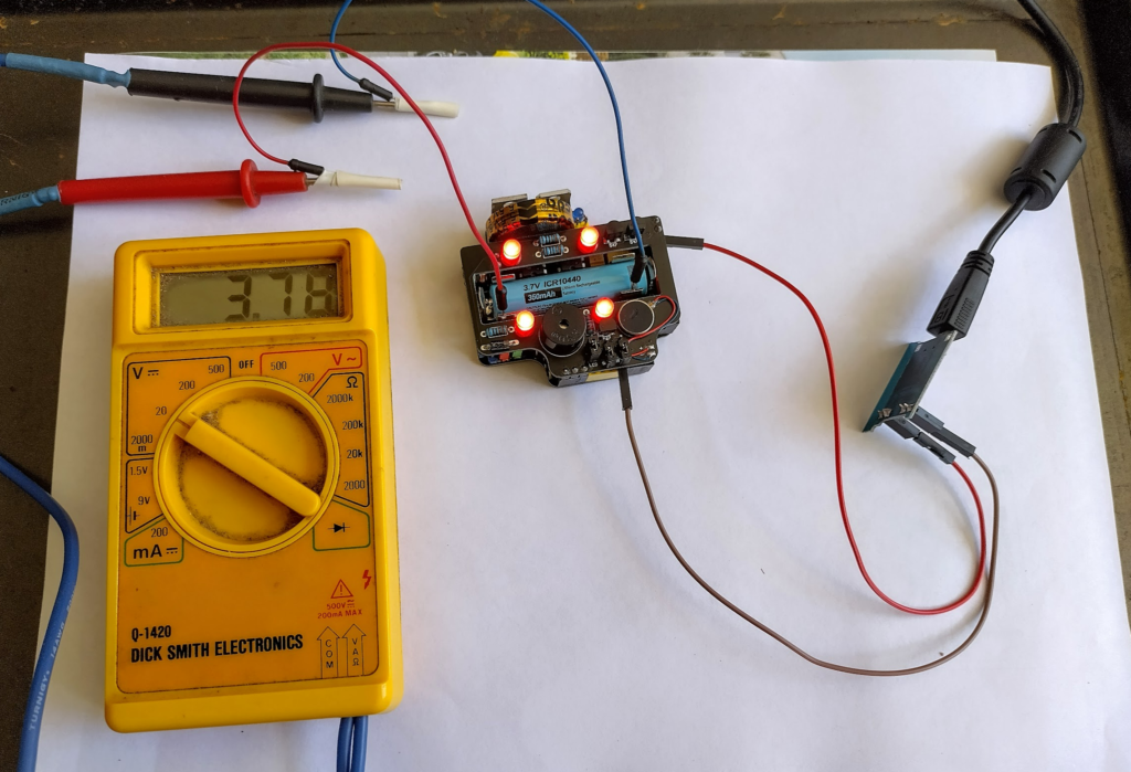 Testing a LI-ION charger board along with a running ResourciBoard device to see if it could run while charging. With an extremely old and dusty Dick Smith multimeter.