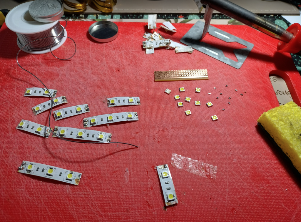Deconstructing LED strip in to their two components - LEDs and resistors.