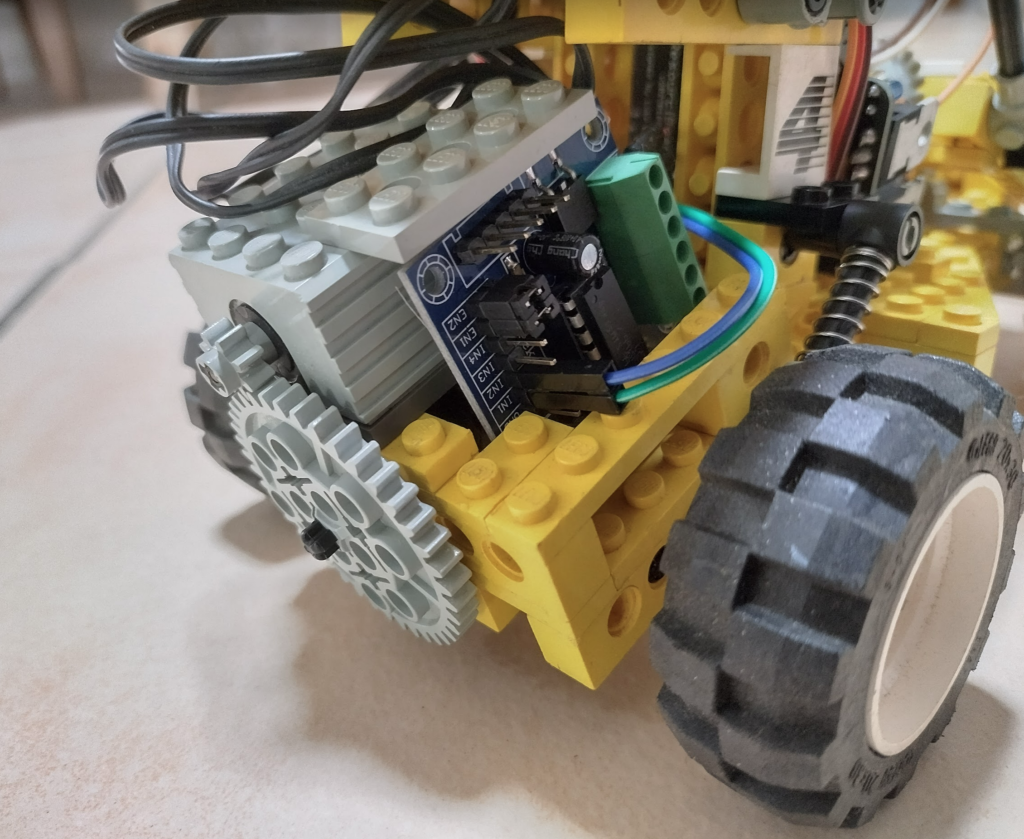 The oldest lego motor in existance, with an L293 controller board to allow for forward/backward motion