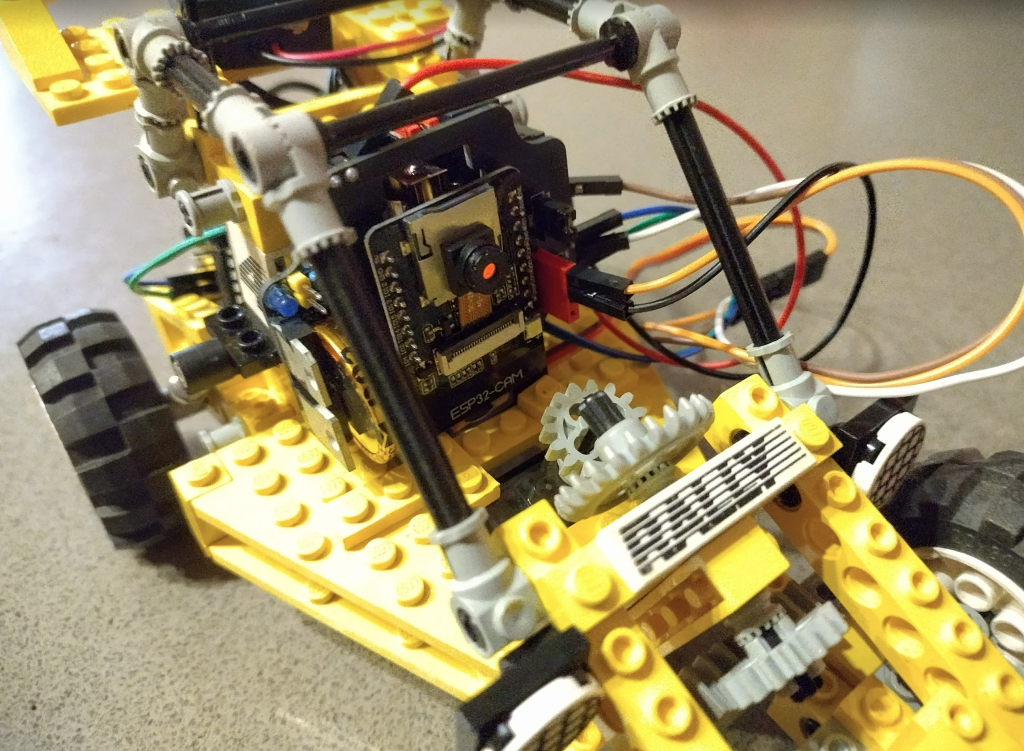 ESP32cam on top of an ATTiny85 ResourciBoard powering an old Lego rally car!