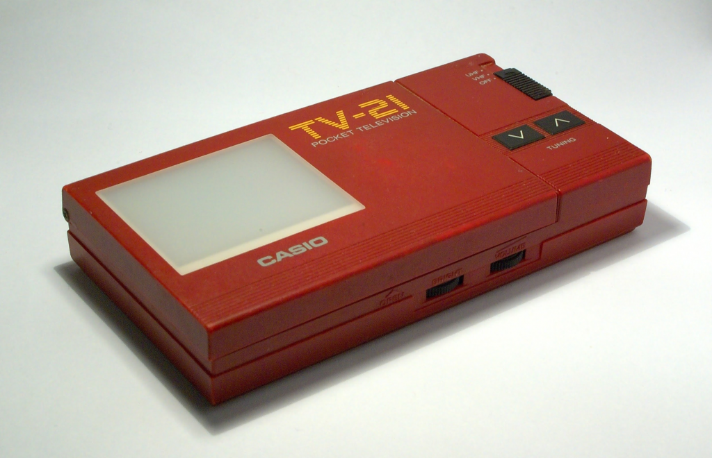 Vintage Casio TV-21 Pocket Television in maroon colour, angle shot while closed.