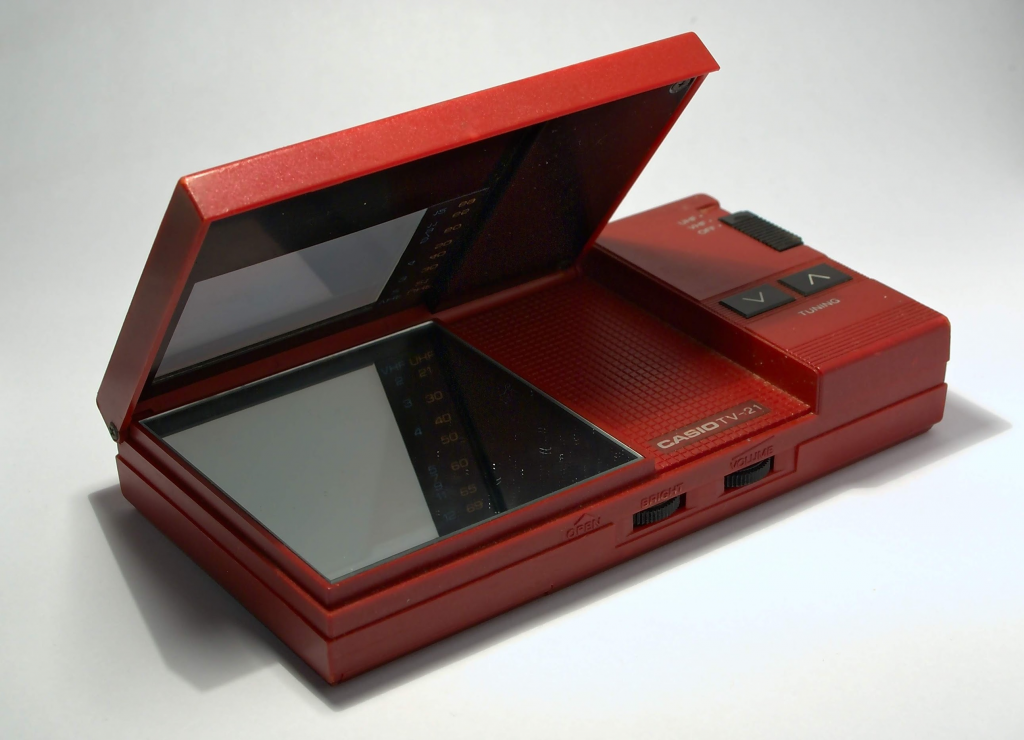 Vintage Casio TV-21 Pocket Television in maroon colour, angle shot while open.