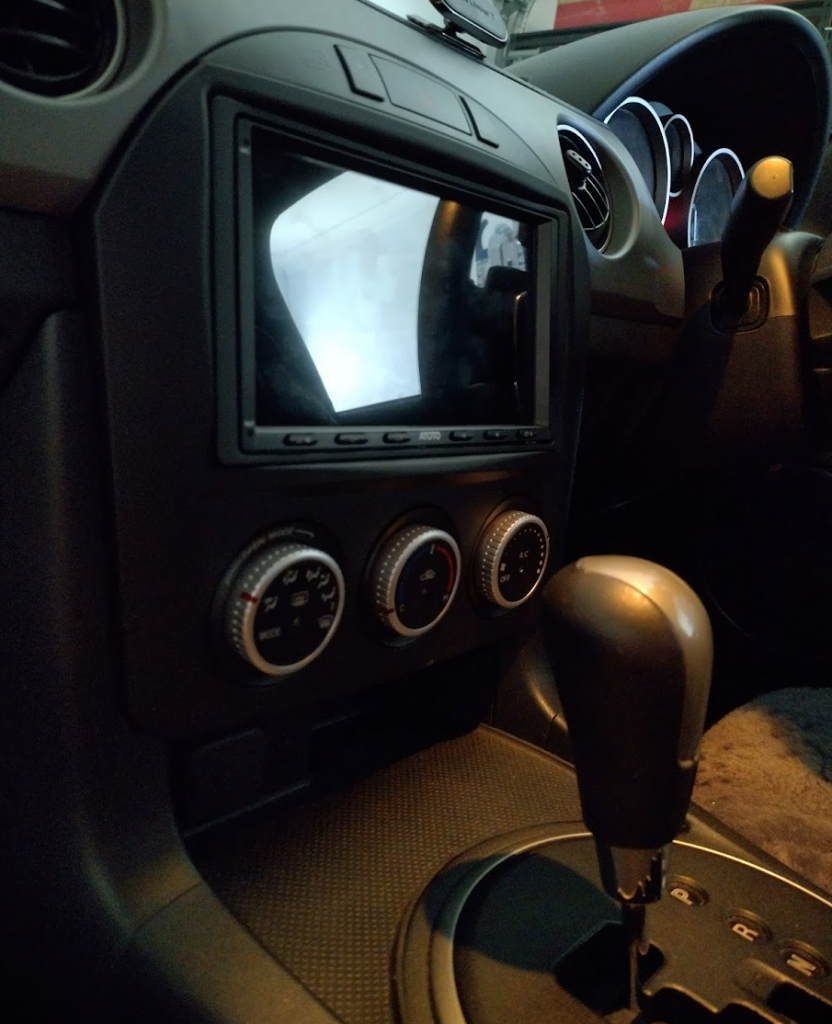 Atoto A6PL mounted in a Metra 99-7519B bezel/faceplate/fascia in a 2009 Mazda MX5 Miata 